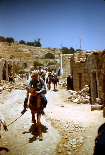 Petra04 Puggin Murphy riding through town on the way to Petra.