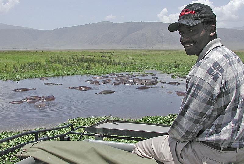 DSCN2272 Alan with his smile, watching a herd of hippos.